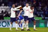 Steven Bergwijn celebrates with Tottenham teammates Lucas Moura and Pierre-Emile Holberg