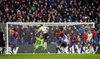 Liverpool's Virgil Van Dijk rises to head in the opening goal against Crystal Palace