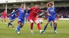 Joe Low (centre) in FA Cup action for Walsall 