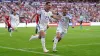 John McGinn, right, celebrates with match-winner Kenny McLean (Zac Goodwin/PA)