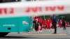 Members of the Philippines Women’s World Cup team walk to their team bus following a shooting near their hotel in the centra