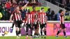 Nathan Collins, left, celebrates after scoring Brentford’s winner (John Walton/PA)