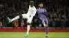 Liverpool defender Joe Gomez battles with Arsenal’s Bukayo Saka during their 2-0 win in the FA Cup (Andrew Matthews/PA)