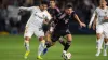 Lionel Messi dribbles past Los Angeles Galaxy midfielder Edwin Cerrillo (Kyusung Gong/AP)