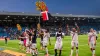 Bayer Leverkusen’s players celebrate 50 undefeated matches in a row after victory at Bochum (David Inderlied/dpa via AP)