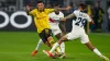 PSG’s Bradley Barcola, right, and Dortmund’s Jadon Sancho (AP)