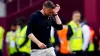 Luton manager Rob Edwards wipes away tears at the final whistle (Victoria Jones/PA).