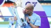 Pep Guardiola kisses the Premier League trophy (Martin Rickett/PA)