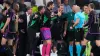 Bayern Munich players argue with referee Szymon Marciniak (Manu Fernandez/AP)