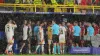 Denmark and Germany players are taken off the pitch as bad weather forces the suspension of their match (Bradley Collyer/PA)