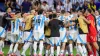 Players of Argentina celebrate defeating Ecuador in a penalty shootout (Julio Cortez/AP)