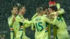 Kieffer Moore (headband) celebrates with his Wales team-mates after opening the scoring against Montenegro (Risto Bozovic/AP