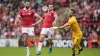 Jack Marriott, centre, scores Wrexham’s third goal after beating Shrewsbury goalkeeper Toby Savin, right (Nick Potts/PA)