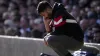 Ruben Amorim crouches down on the touchline (Peter Byrne/PA)