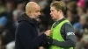 Manchester City manager Pep Guardiola (left) speaks with Kevin De Bruyne (Martin Rickett/PA)