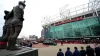 The funeral procession for Denis Law passes the Trinity Statue outside Old Trafford (Martin Rickett/PA)