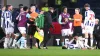 Burnley’s CJ Egan-Riley, centre left, is restrained after being sent off by referee Gavin Ward, second right (Gary Oakley/PA