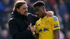 Leeds manager Daniel Farke (left) consoles Junior Firpo after the 1-0 defeat at Portsmouth (Zac Goodwin/PA).